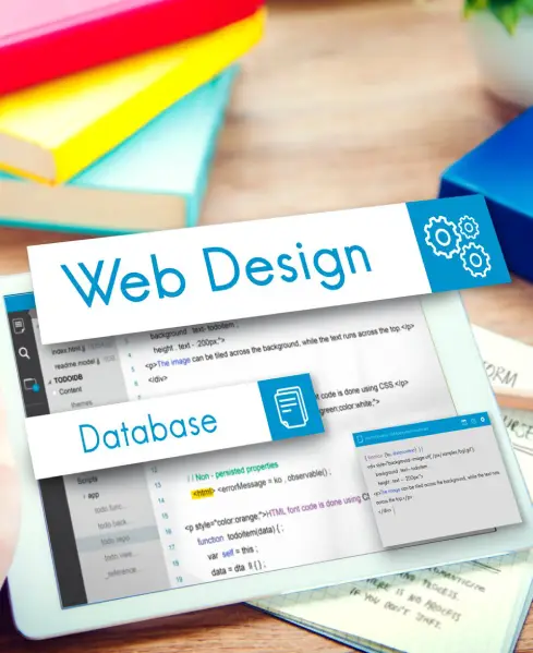 A tablet on a desk displays Web Design and Database concepts overlaid on code, with colorful books in the background