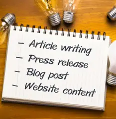 A notebook displays a checklist of content types: Article writing, Press release, Blog post, and Website content, surrounded by light bulbs